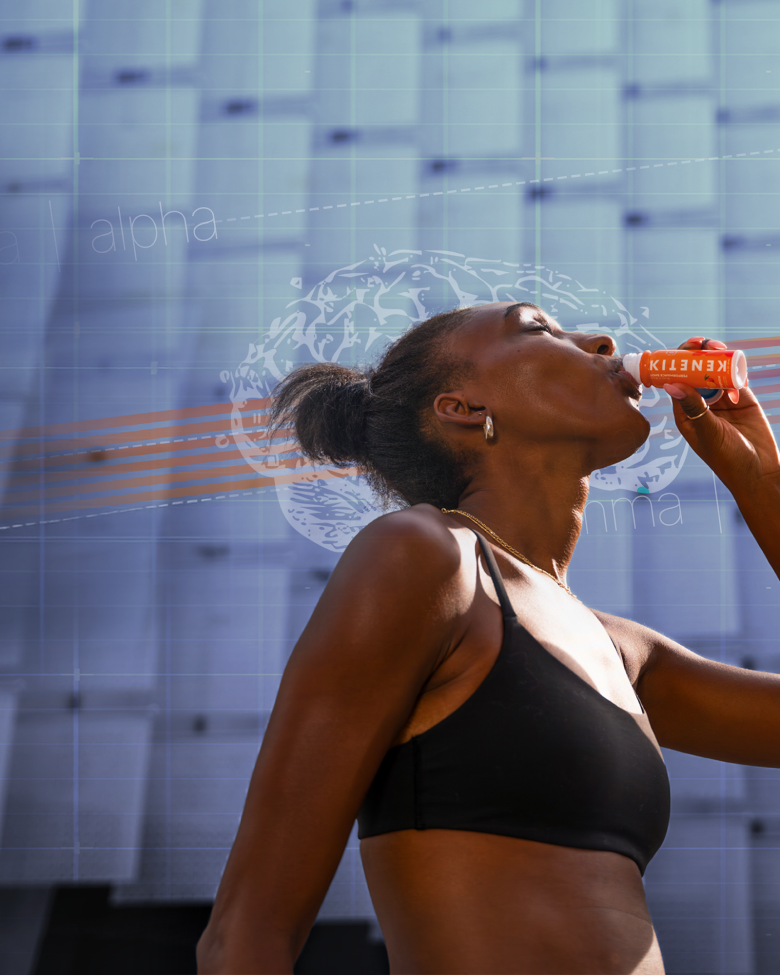 Runner drinking a Kenetik shot in front of a stadium