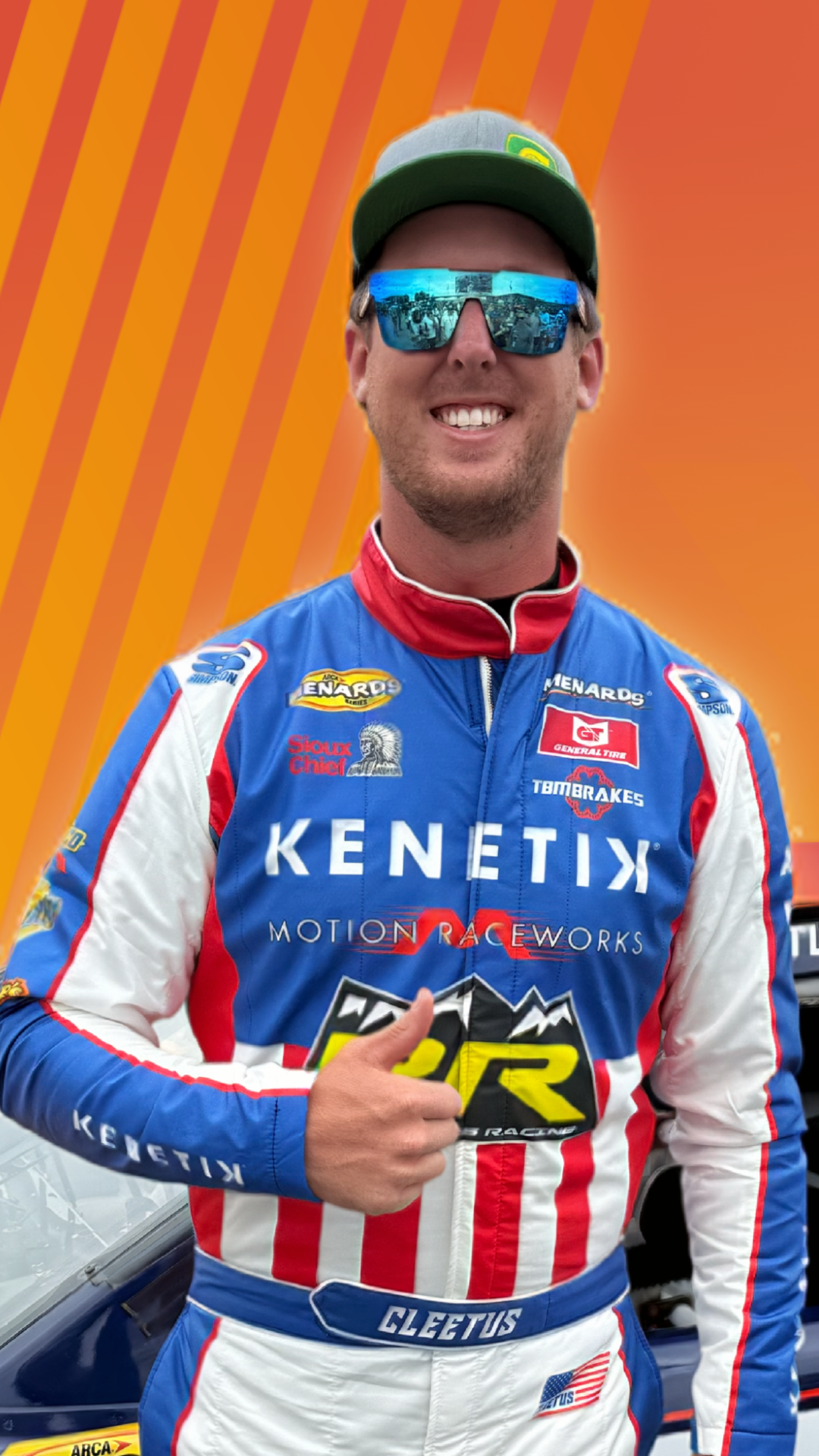 Cleetus giving a thumbs up in his Kenetik racesuit in front of his #30 Kenetik Car.