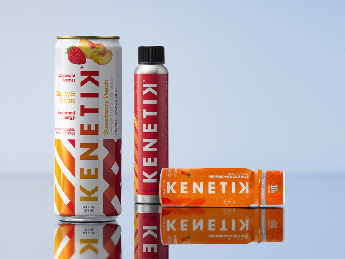 Kenetik can, shot and concentrate box on a reflective surface